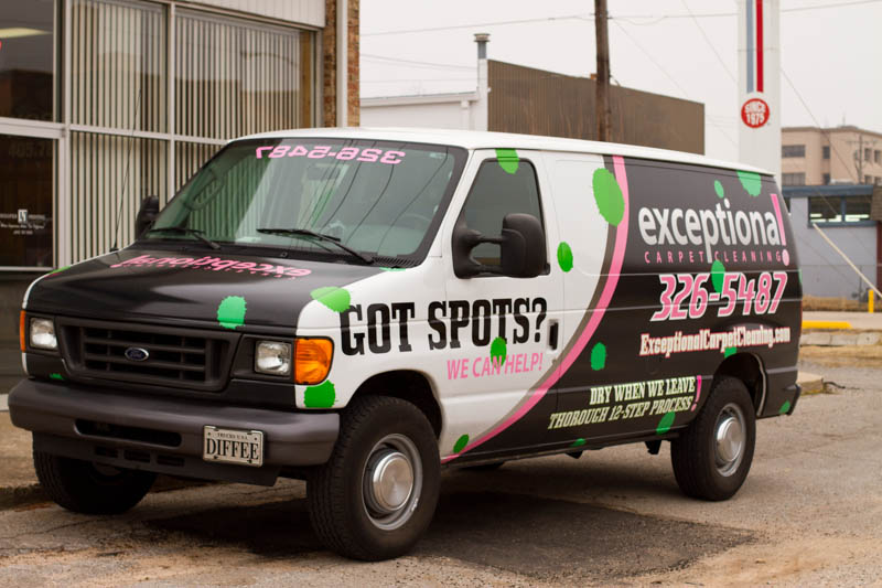 A black and white van wrap with colored paint drops for Exceptional Carpet Cleaning