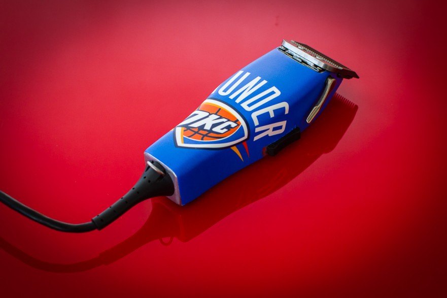 Custom Wrap on barber clippers with the Thunder theme